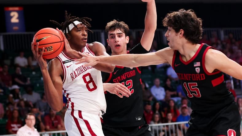 Nov 22, 2023; Paradise Island, BAHAMAS;  Arkansas Razorbacks forward Chandler Lawson (8) looks to pass as Stanford Cardinal guard Benny Gealer (15) defends during the first half at Imperial Arena. Mandatory Credit: Kevin Jairaj-USA TODAY Sports