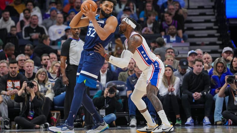 Nov 22, 2023; Minneapolis, Minnesota, USA; Philadelphia 76ers forward Robert Covington (33) defends Minnesota Timberwolves center Karl-Anthony Towns (32) in the second quarter at Target Center. Mandatory Credit: Brad Rempel-USA TODAY Sports
