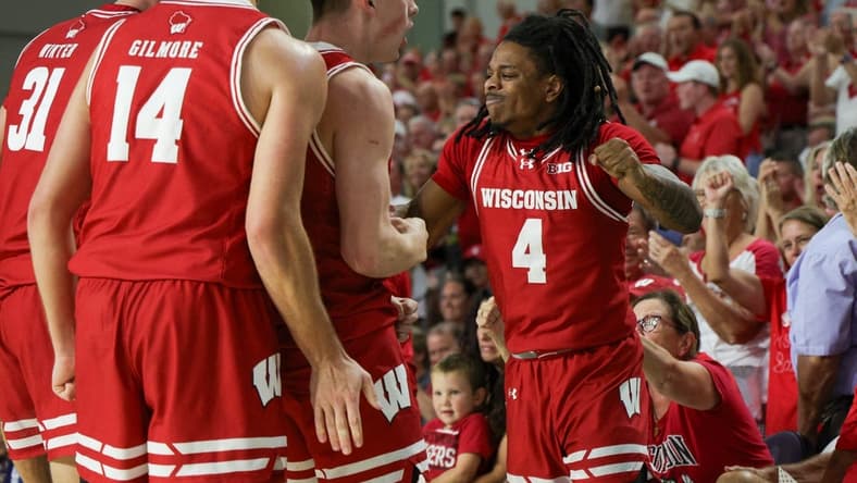 Nov 22, 2023; Fort Myers, FL, USA;  Wisconsin Badgers guard Kamari McGee (4) reacts a after a play against the Southern Methodist Mustangs in the first half during the Fort Myers Tip-Off championship game at Suncoast Credit Union Arena. Mandatory Credit: Nathan Ray Seebeck-USA TODAY Sports