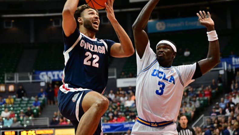 Nov 22, 2023; Honolulu, HI, USA; sGonzaga Bulldogs forward Anton Watson (22) shoots the ball defended by UCLA Bruins forward Adem Bona (3) during the first period at SimpliFi Arena at Stan Sheriff Center. Mandatory Credit: Steven Erler-USA TODAY Sports