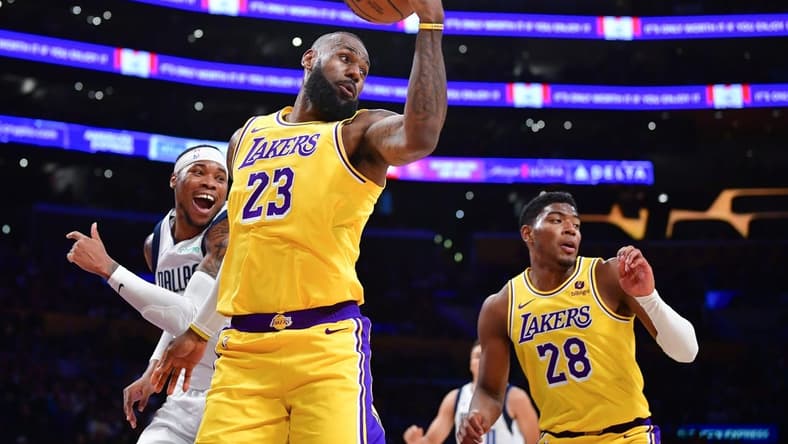 Nov 22, 2023; Los Angeles, California, USA; Los Angeles Lakers forward LeBron James (23) gets the rebound against the Dallas Mavericks during the first half at Crypto.com Arena. Mandatory Credit: Gary A. Vasquez-USA TODAY Sports