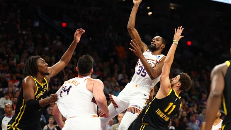 Nov 22, 2023; Phoenix, Arizona, USA; Phoenix Suns forward Kevin Durant (35) shoots the ball against the Golden State Warriors in the second half at Footprint Center. Mandatory Credit: Mark J. Rebilas-USA TODAY Sports