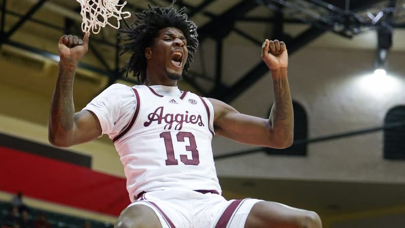 Nov 23, 2023; Kissimmee, FL, USA;  Texas A&M Aggies forward Solomon Washington (13) dunks the ball against the Penn State Nittany Lions in the second half during the ESPN Events Invitational at State Farm Field House. Mandatory Credit: Nathan Ray Seebeck-USA TODAY Sports