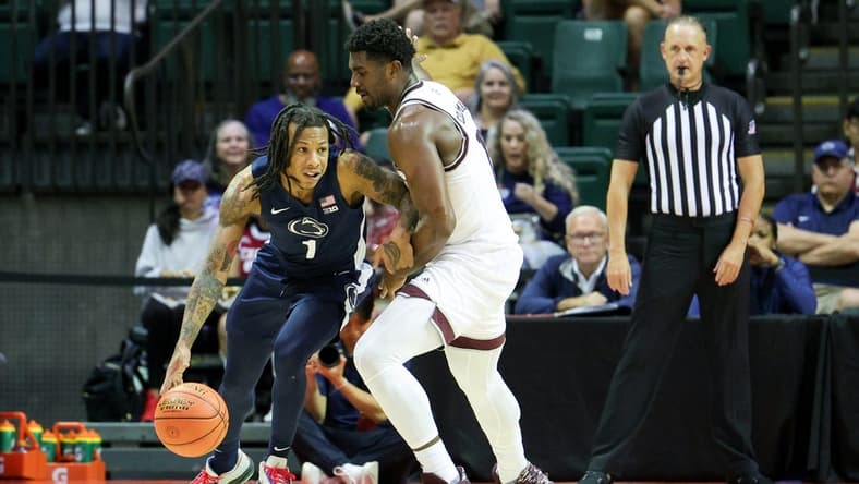 Nov 23, 2023; Kissimmee, FL, USA;  Texas A&M Aggies forward Henry Coleman III (15) guards Penn State Nittany Lions guard Ace Baldwin Jr. (1) in the second half during the ESPN Events Invitational at State Farm Field House. Mandatory Credit: Nathan Ray Seebeck-USA TODAY Sports