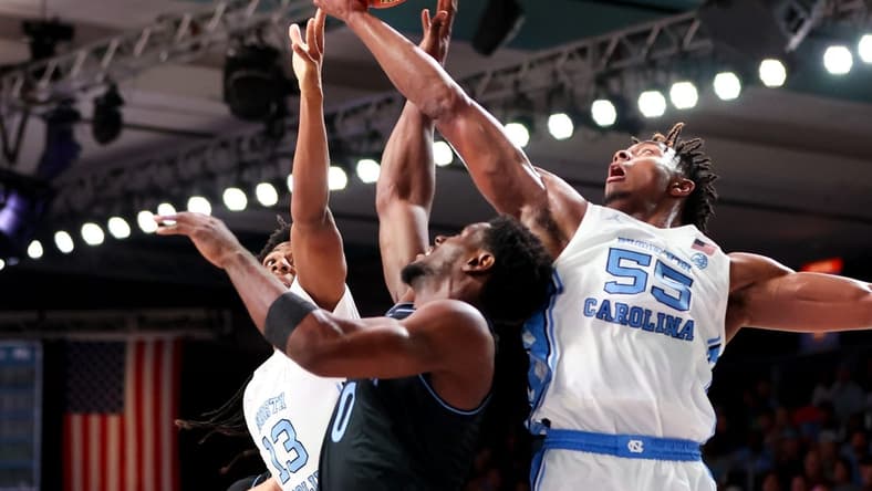 Nov 23, 2023; Paradise Island, BAHAMAS;  North Carolina Tar Heels forward Harrison Ingram (55) and North Carolina Tar Heels forward Jalen Washington (13) battle for the ball with Villanova Wildcats guard TJ Bamba (0) during the first half at Imperial Arena. Mandatory Credit: Kevin Jairaj-USA TODAY Sports