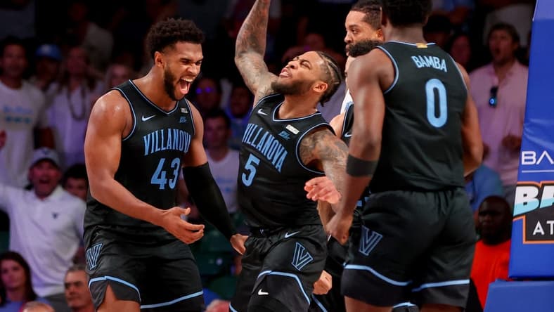 Nov 23, 2023; Paradise Island, BAHAMAS;  Villanova Wildcats forward Eric Dixon (43) and Villanova Wildcats guard Justin Moore (5) celebrate during the second half against the North Carolina Tar Heels at Imperial Arena. Mandatory Credit: Kevin Jairaj-USA TODAY Sports
