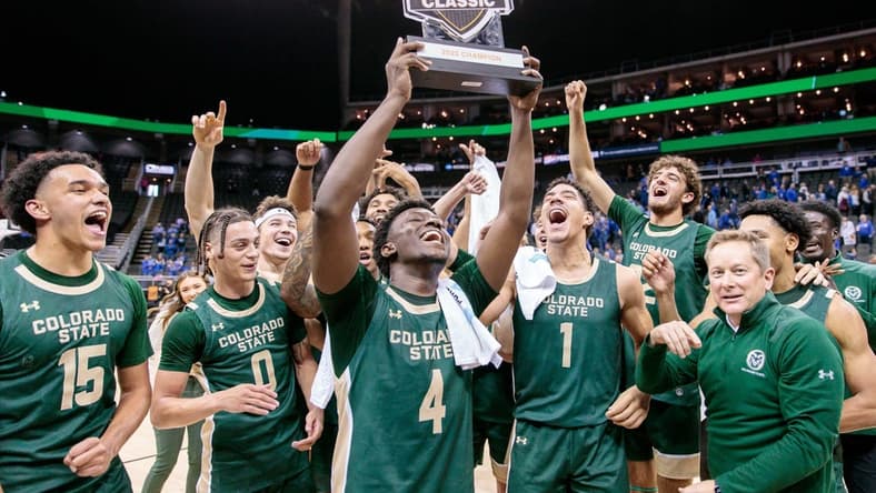 Nov 23, 2023; Kansas City, Missouri, USA; against the Colorado State Rams hold up the championship trophy after the game against the Creighton Bluejays at T-Mobile Center. Mandatory Credit: William Purnell-USA TODAY Sports