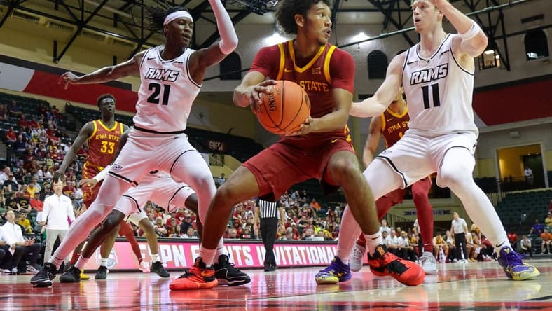 Nov 23, 2023; Kissimmee, Florida, USA;  Iowa State Cyclones guard Curtis Jones (5) look to pass the ball guarded by Virginia Commonwealth Rams forward Christian Fermin (21) and guard Max Shulga (11) in the first half  in the first half during the ESPN Events Invitational at State Farm Field House. Mandatory Credit: Nathan Ray Seebeck-USA TODAY Sports