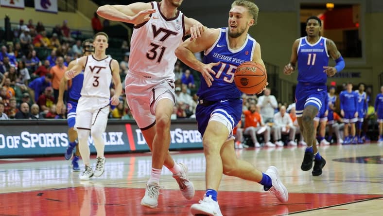 Nov 23, 2023; Kissimmee, FL, USA;  Boise State Broncos guard Jace Whiting (15) drives to the basket past Virginia Tech Hokies forward Robbie Beran (31) in the first half during the ESPN Events Invitational at State Farm Field House. Mandatory Credit: Nathan Ray Seebeck-USA TODAY Sports