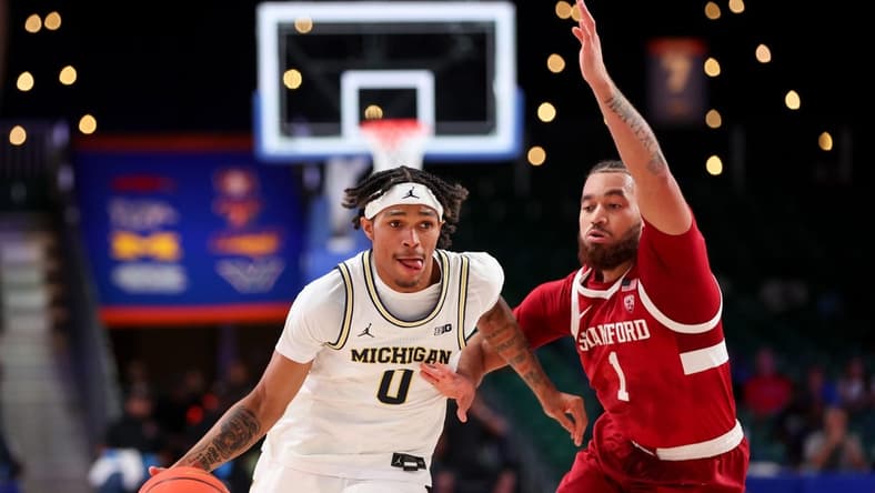 Nov 23, 2023; Paradise Island, BAHAMAS;  Michigan Wolverines guard Dug McDaniel (0) drives to the basket as Stanford Cardinal guard Jared Bynum (1) defends during the first half at Imperial Arena. Mandatory Credit: Kevin Jairaj-USA TODAY Sports
