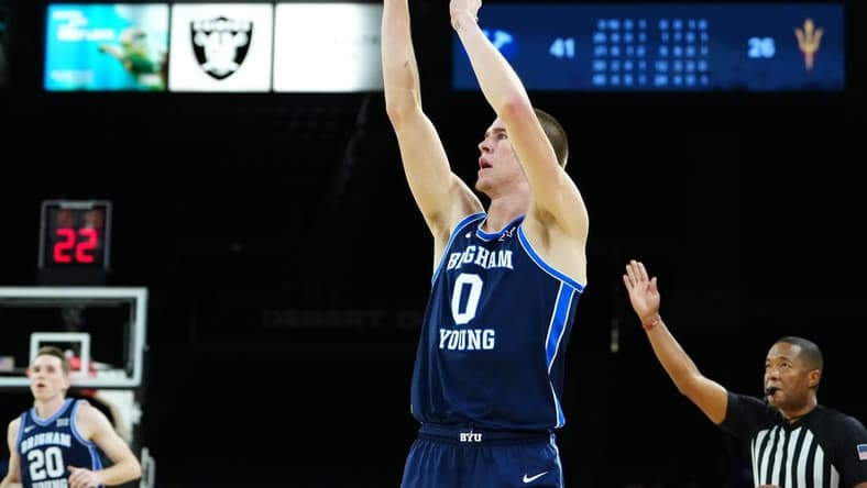 Nov 23, 2023; Las Vegas, Nevada, USA; Brigham Young Cougars forward Noah Waterman (0) shoots against the Arizona State Sun Devils during the second half at Michelob Ultra Arena. Mandatory Credit: Stephen R. Sylvanie-USA TODAY Sports