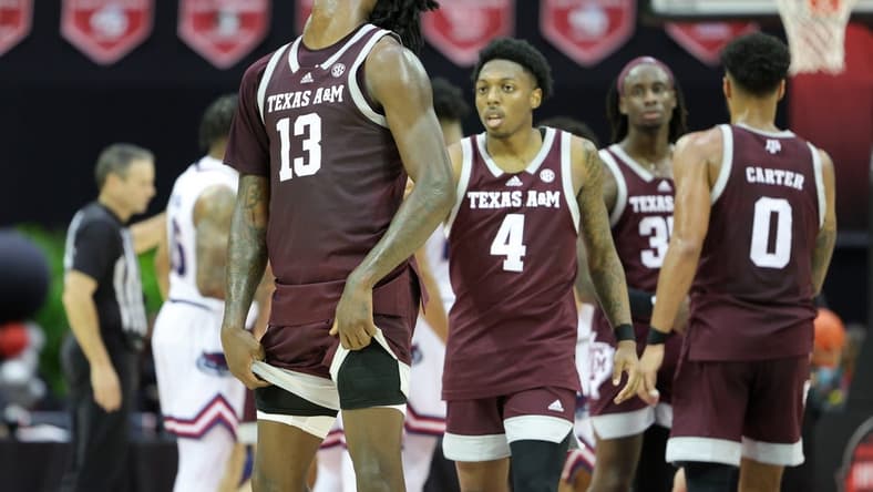 Nov 24, 2023; Kissimmee, FL, USA;  Texas A&M Aggies forward Solomon Washington (13) reacts after a call in a game against the Florida Atlantic Owls in the second half during the ESPN Events Invitational Semifinals at State Farm Field House. Mandatory Credit: Nathan Ray Seebeck-USA TODAY Sports