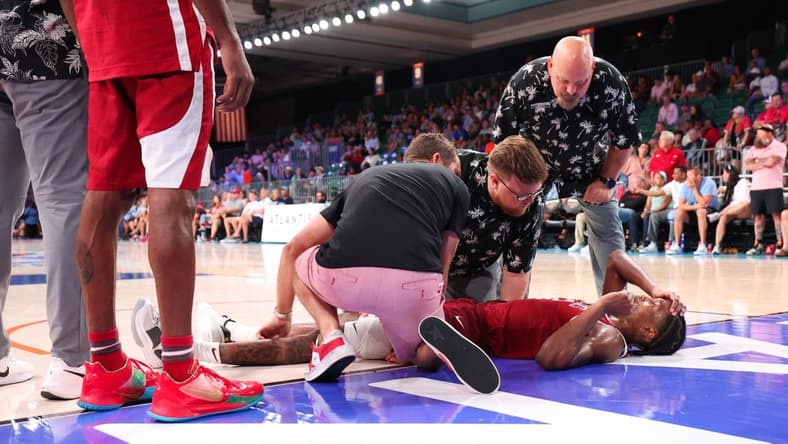Nov 24, 2023; Paradise Island, BAHAMAS;  Arkansas Razorbacks guard Tramon Mark (12) lays injured on the ground during the second half against the North Carolina Tar Heels at Imperial Arena. Mandatory Credit: Kevin Jairaj-USA TODAY Sports