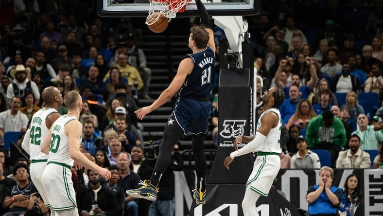 Nov 24, 2023; Orlando, Florida, USA; Orlando Magic forward Moritz Wagner (21) dunks the ball against the Boston Celtics in the second quarter at Amway Center. Mandatory Credit: Jeremy Reper-USA TODAY Sports