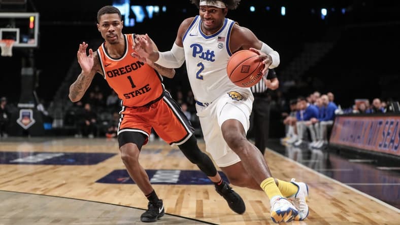 Nov 24, 2023; Brooklyn, NY, USA;  Pittsburgh Panthers forward Blake Hinson (2) drives past Oregon State Beavers guard Christian Wright (1) in the first half at Barclay Center. Mandatory Credit: Wendell Cruz-USA TODAY Sports