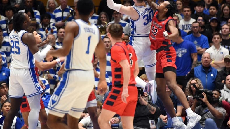 Nov 24, 2023; Durham, North Carolina, USA; Duke Blue Devils center Kyle Filipowski (30) shoots the ball in front of Southern Indiana Screaming Eagles center Kiyron Powell (52) during the first half at Cameron Indoor Stadium. Mandatory Credit: Rob Kinnan-USA TODAY Sports