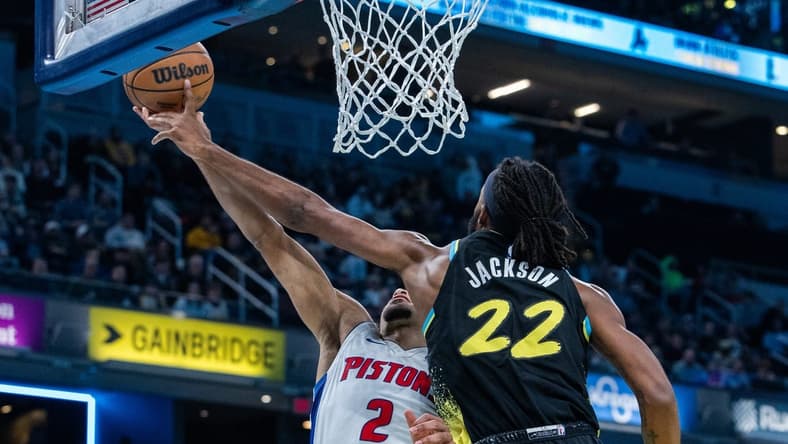 Nov 24, 2023; Indianapolis, Indiana, USA; Indiana Pacers forward Isaiah Jackson (22) blocks the shot of Detroit Pistons guard Cade Cunningham (2) in the first half at Gainbridge Fieldhouse. Mandatory Credit: Trevor Ruszkowski-USA TODAY Sports
