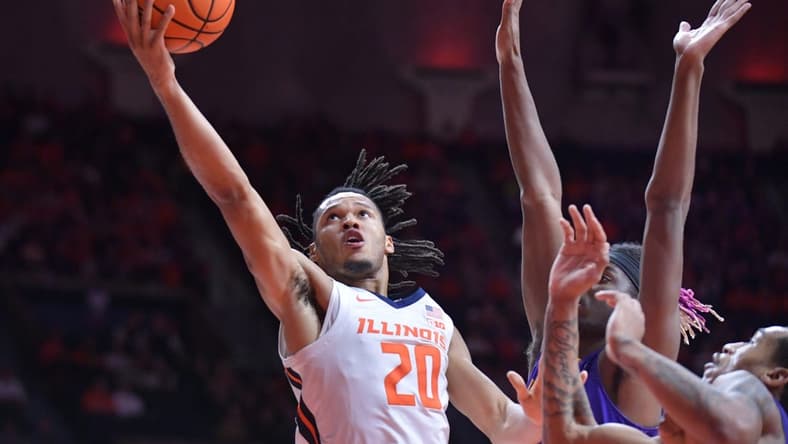 Nov 24, 2023; Champaign, Illinois, USA;  Illinois Fighting Illini forward Ty Rodgers (20) drives to the basket during the first half against the Western Illinois Leathernecks at State Farm Center. Mandatory Credit: Ron Johnson-USA TODAY Sports