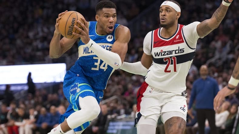 Nov 24, 2023; Milwaukee, Wisconsin, USA;  Milwaukee Bucks forward Giannis Antetokounmpo (34) drives for the basket against Washington Wizards center Daniel Gafford (21) during the fourth quarter at Fiserv Forum. Mandatory Credit: Jeff Hanisch-USA TODAY Sports