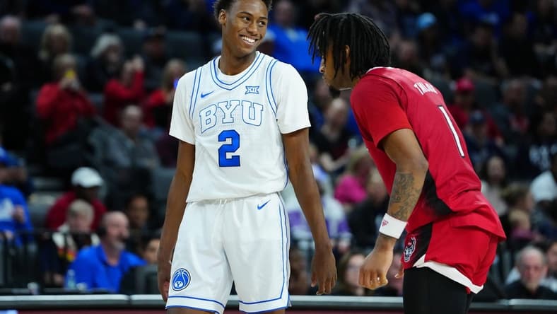 Nov 24, 2023; Las Vegas, NV, USA; Brigham Young Cougars guard Jaxson Robinson (2) and North Carolina State Wolfpack guard Jayden Taylor (1) await an inbounds play during the second half at Michelob ULTRA Arena. Mandatory Credit: Stephen R. Sylvanie-USA TODAY Sports