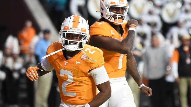 Tennessee quarterback Joe Milton III (7) and Jabari Small (2) celebrate Milton's touchdown during an NCAA college football game against Vanderbilt on Saturday, November 25, 2023 in Knoxville, Tenn.