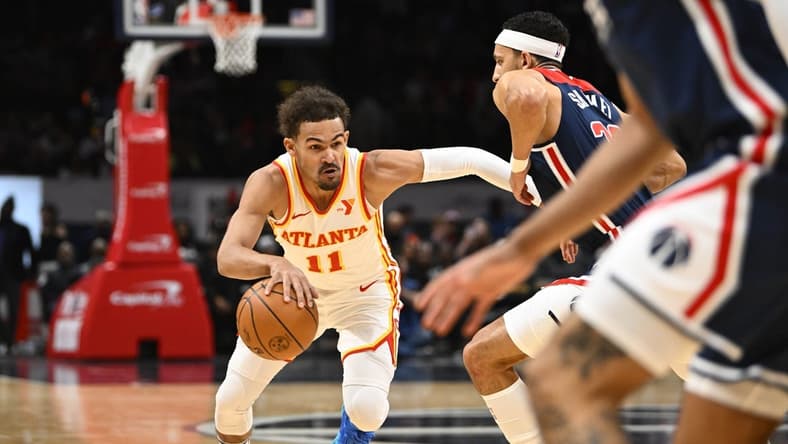 Nov 25, 2023; Washington, District of Columbia, USA; Atlanta Hawks guard Trae Young (11) dribbles against the Washington Wizards during the first half at Capital One Arena. Mandatory Credit: Brad Mills-USA TODAY Sports