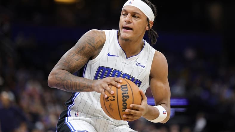 Nov 26, 2023; Orlando, Florida, USA;  Orlando Magic forward Paolo Banchero (5) controls the ball against the Charlotte Hornets in the second quarter at Amway Center. Mandatory Credit: Nathan Ray Seebeck-USA TODAY Sports