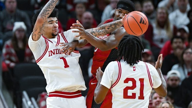 Indiana Hoosiers center Kel'el Ware (1) knocks the ball away from Harvard Crimson guard Chandler Pigge (13) during the game against Harvard in Gainbridge Fieldhouse in Indianapolis, Ind. on Sunday, Nob. 26, 2023.
