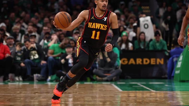 Nov 26, 2023; Boston, Massachusetts, USA; Atlanta Hawks guard Trae Young (11) brings the ball up the court against the Boston Celtics during the second quarter at TD Garden. Mandatory Credit: Winslow Townson-USA TODAY Sports