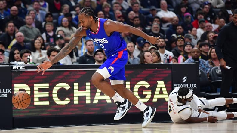 Nov 27, 2023; Los Angeles, California, USA; Los Angeles Clippers forward Kawhi Leonard (2) steals the ball from Denver Nuggets guard Reggie Jackson (7) during the first half at Crypto.com Arena. Mandatory Credit: Gary A. Vasquez-USA TODAY Sports