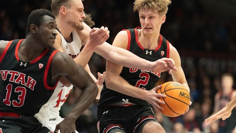 Nov 27, 2023; Moraga, California, USA;  Utah Utes guard Cole Bajema (2) controls the ball during the first half against St. Mary's Gaels center Mitchell Saxen (11) at University Credit Union Pavilion. Mandatory Credit: Stan Szeto-USA TODAY Sports