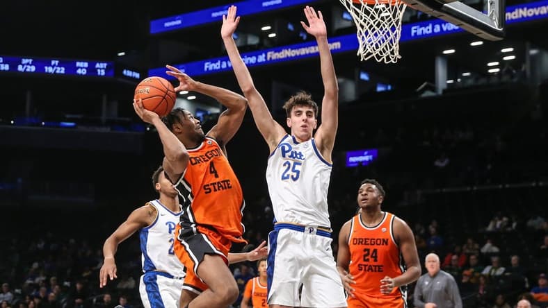 Nov 24, 2023; Brooklyn, NY, USA; Oregon State Beavers guard Dexter Akanno (4) and Pittsburgh Panthers forward Guillermo Diaz Graham (25) at Barclay Center. Mandatory Credit: Wendell Cruz-USA TODAY Sports