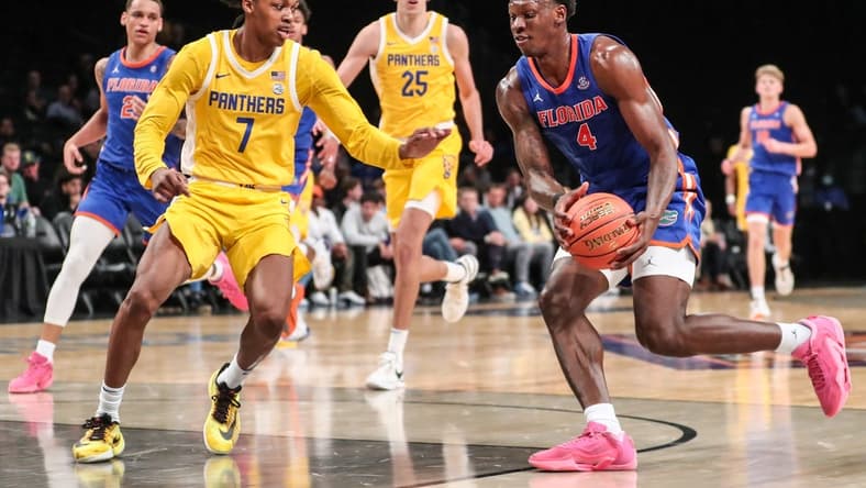 Nov 22, 2023; Brooklyn, New York, USA; Florida Gators forward Tyrese Samuel (4) and Pittsburgh Panthers guard Carlton Carrington (7) at Barclays Center. Mandatory Credit: Wendell Cruz-USA TODAY Sports