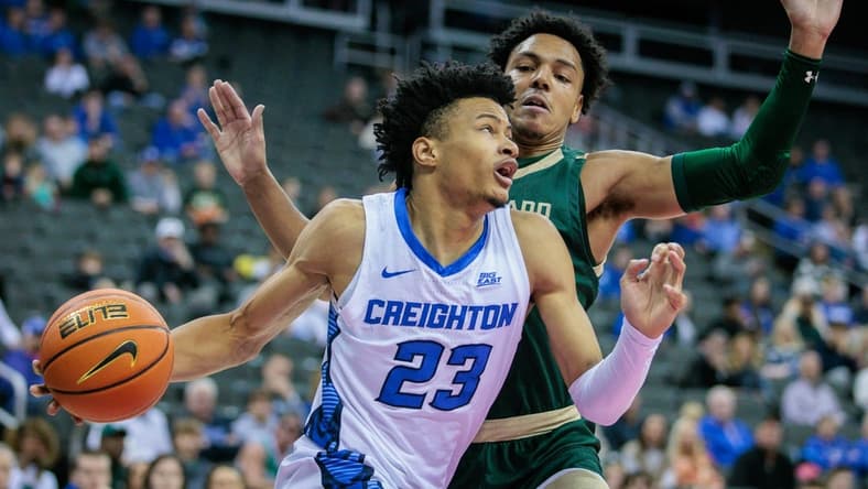 Nov 23, 2023; Kansas City, Missouri, USA; Creighton Bluejays guard Trey Alexander (23) drives around Colorado State Rams guard Nique Clifford (10) at T-Mobile Center. Mandatory Credit: William Purnell-USA TODAY Sports