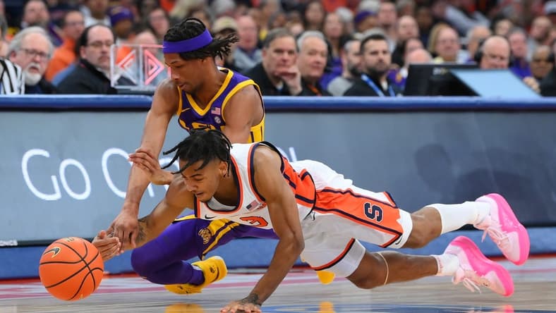 Nov 28, 2023; Syracuse, New York, USA; Syracuse Orange guard Judah Mintz (3) and LSU Tigers guard Mike Williams III (2) battle for a loose ball during the first half at the JMA Wireless Dome. Mandatory Credit: Rich Barnes-USA TODAY Sports