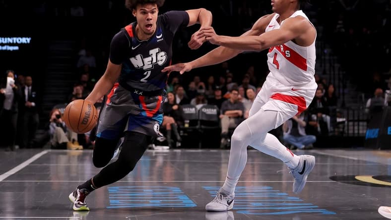 Nov 28, 2023; Brooklyn, New York, USA; Brooklyn Nets forward Cameron Johnson (2) controls the ball against Toronto Raptors forward Scottie Barnes (4) during the second quarter at Barclays Center. Mandatory Credit: Brad Penner-USA TODAY Sports