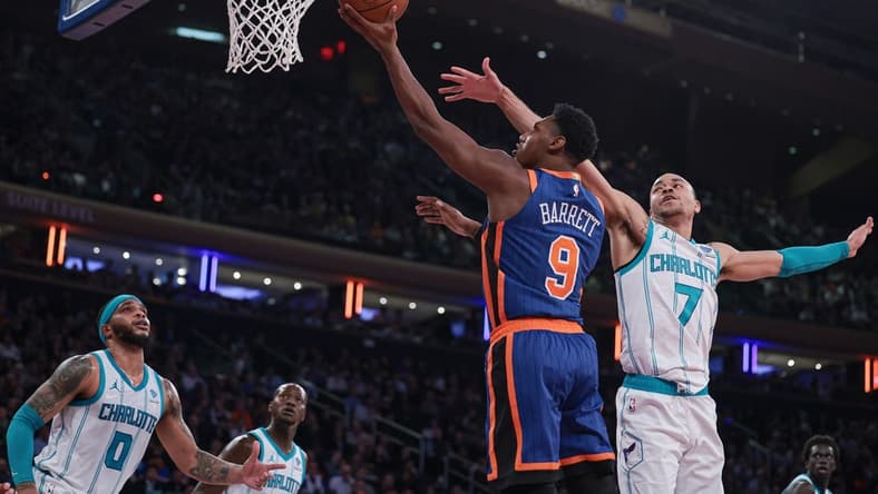 Nov 28, 2023; New York, New York, USA; New York Knicks guard RJ Barrett (9) drives to the basket as Charlotte Hornets guard Bryce McGowens (7) and forward Miles Bridges (0) defend during the first half at Madison Square Garden. Mandatory Credit: Vincent Carchietta-USA TODAY Sports