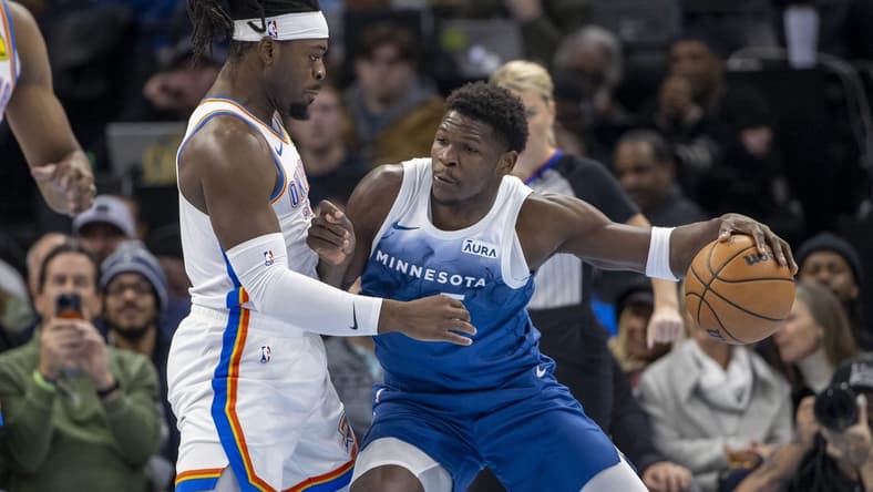 Nov 28, 2023; Minneapolis, Minnesota, USA; Minnesota Timberwolves guard Anthony Edwards (5) backs toward the basket as Oklahoma City Thunder guard Luguentz Dort (5) plays defense in the first half at Target Center. Mandatory Credit: Jesse Johnson-USA TODAY Sports