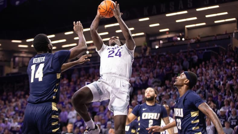 Kansas State junior transfer wing Arthur Kaluma (24) looks for a layup against Oral Roberts during the first half of Tuesday's game inside Bramlage Coliseum.