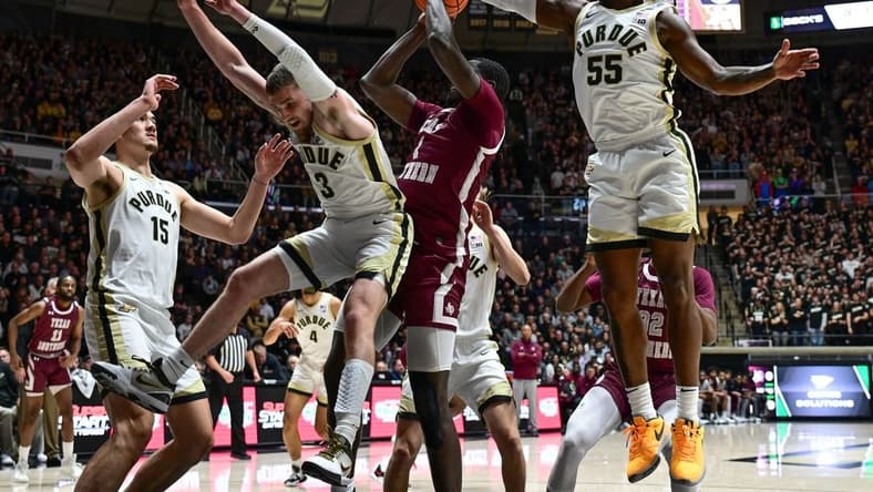 Nov 28, 2023; West Lafayette, Indiana, USA; Purdue Boilermakers guard Lance Jones (55) blocks a shot by Texas Southern Tigers forward Jahmar Young Jr. (2) during the first half at Mackey Arena. Mandatory Credit: Marc Lebryk-USA TODAY Sports
