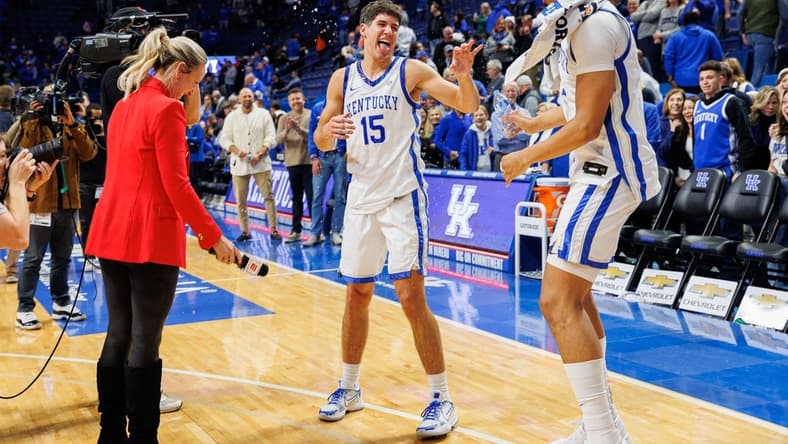 Nov 28, 2023; Lexington, Kentucky, USA; Kentucky Wildcats forward Tre Mitchell (4) dumps water on guard Reed Sheppard (15) after the game against the Miami (Fl) Hurricanes at Rupp Arena at Central Bank Center. Mandatory Credit: Jordan Prather-USA TODAY Sports