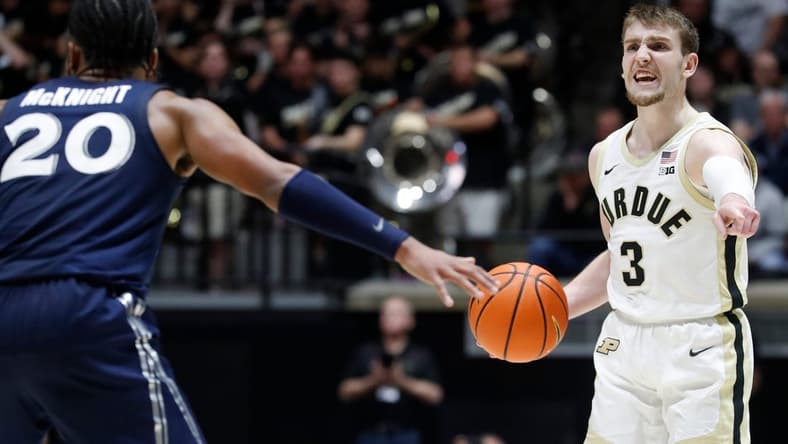 Xavier Musketeers guard Dayvion McKnight (20) defends Purdue Boilermakers guard Braden Smith (3) during the NCAA men s basketball game, Monday, Nov. 13, 2023, at Mackey Arena in West Lafayette, Ind. Purdue Boilermakers won 83-71.