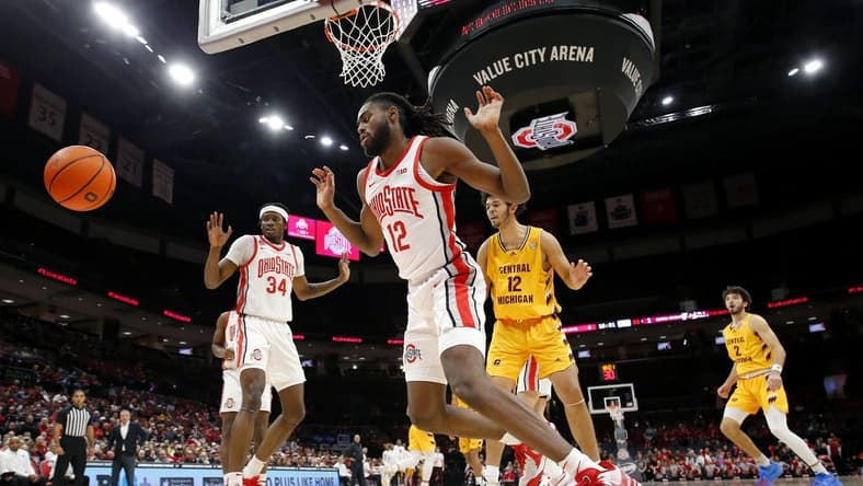 Nov 29, 2023; Columbus, Ohio, USA; Ohio State Buckeyes center Felix Okpara (34) and guard Evan Mahaffey (12) blocks the shot of Central Michigan Chippewas center Hunter Harding (12) during the first half at Value City Arena. Mandatory Credit: Joseph Maiorana-USA TODAY Sports