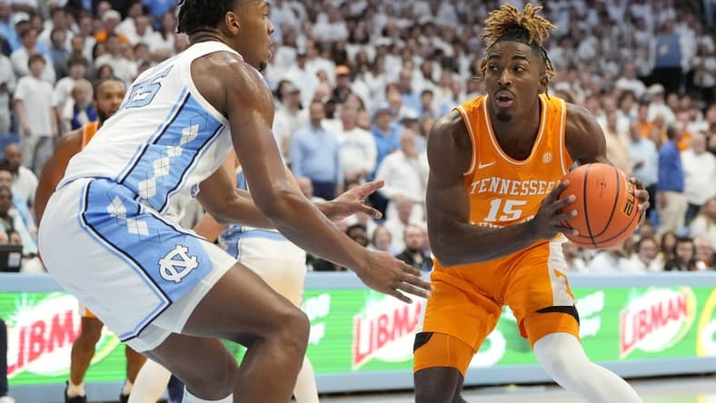 Nov 29, 2023; Chapel Hill, North Carolina, USA; Tennessee Volunteers guard Jahmai Mashack (15) looks to pass as North Carolina Tar Heels forward Harrison Ingram (55) defends in the first half at Dean E. Smith Center. Mandatory Credit: Bob Donnan-USA TODAY Sports