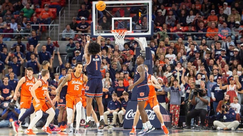 Auburn Tigers guard Aden Holloway (1) takes a jump shot as Auburn Tigers take on Virginia Tech Hokies at Neville Arena in Auburn, Ala., on Wednesday, Nov. 29, 2023.
