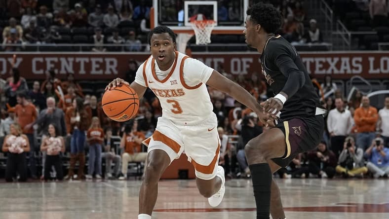 Nov 30, 2023; Austin, Texas, USA; Texas Longhorns
guard Max Abmas (3) looks to pass the ball while defended by Texas State Bobcats guard Dylan Dawson (0) during the second half at Moody Center. Mandatory Credit: Scott Wachter-USA TODAY Sports