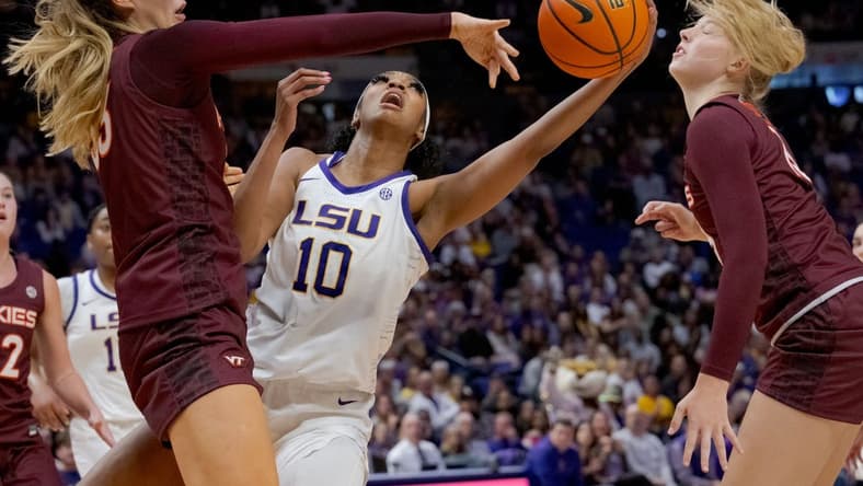 Nov 30, 2023; Baton Rouge, Louisiana, USA; Virginia Tech Hokies center Elizabeth Kitley (33) blocks the shot of LSU Lady Tigers forward Angel Reese (10) next Virginia Tech Hokies center Clara Strack (13) during the first half at Pete Maravich Assembly Center. Mandatory Credit: Matthew Hinton-USA TODAY Sports