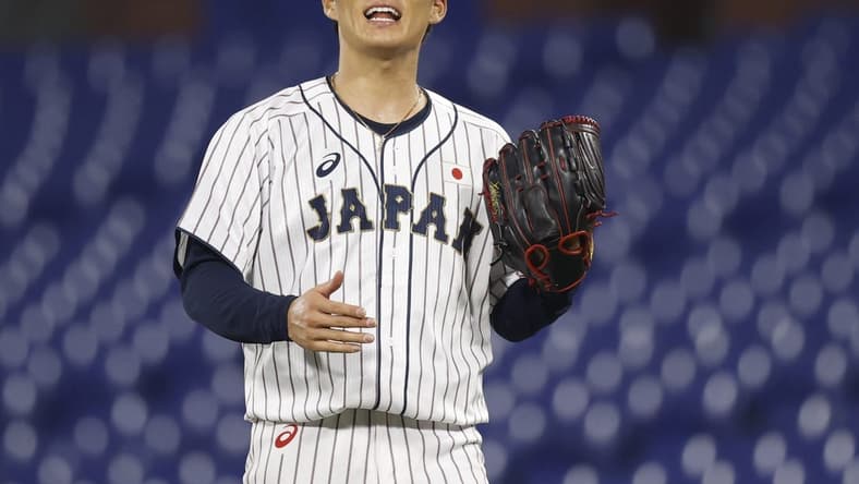 Aug 4, 2021; Yokohama, Japan; Team Japan pitcher Yoshinobu Yamamoto (17) reacts against Korea in a baseball semifinal match during the Tokyo 2020 Olympic Summer Games at Yokohama Baseball Stadium. Mandatory Credit: Yukihito Taguchi-USA TODAY Sports