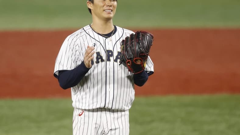 Aug 4, 2021; Yokohama, Japan; Team Japan pitcher Yoshinobu Yamamoto (17) reacts against Korea in a baseball semifinal match during the Tokyo 2020 Olympic Summer Games at Yokohama Baseball Stadium. Mandatory Credit: Yukihito Taguchi-USA TODAY Sports