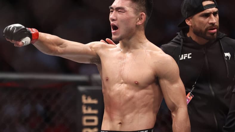 Aug 7, 2021; Houston, Texas, USA; Song Yadong (red gloves) reacts to fight against Casey Kenney (blue gloves) during UFC 265 at Toyota Center. Mandatory Credit: Troy Taormina-USA TODAY Sports